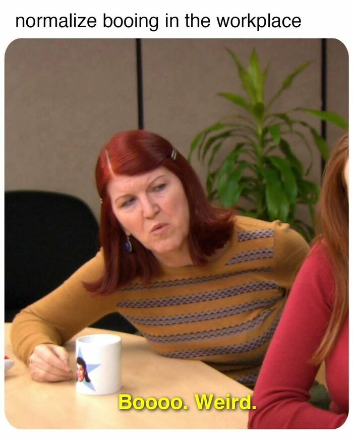 Woman with red hair booing in the workplace, illustrating hilariously relatable memes about adulthood challenges.