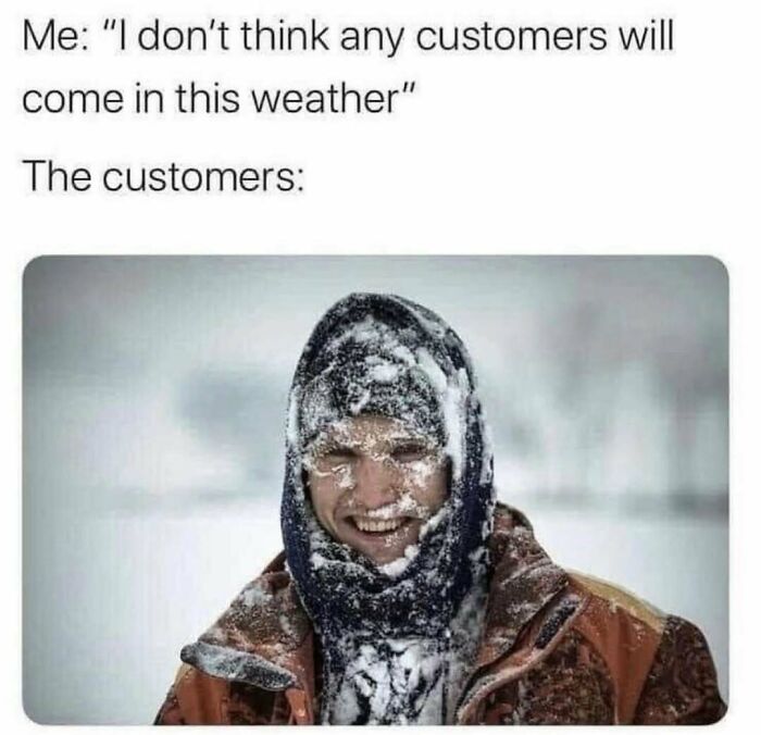 Person covered in snow smiling outside in cold weather, illustrating meme scrolling humor and customer persistence in bad weather.