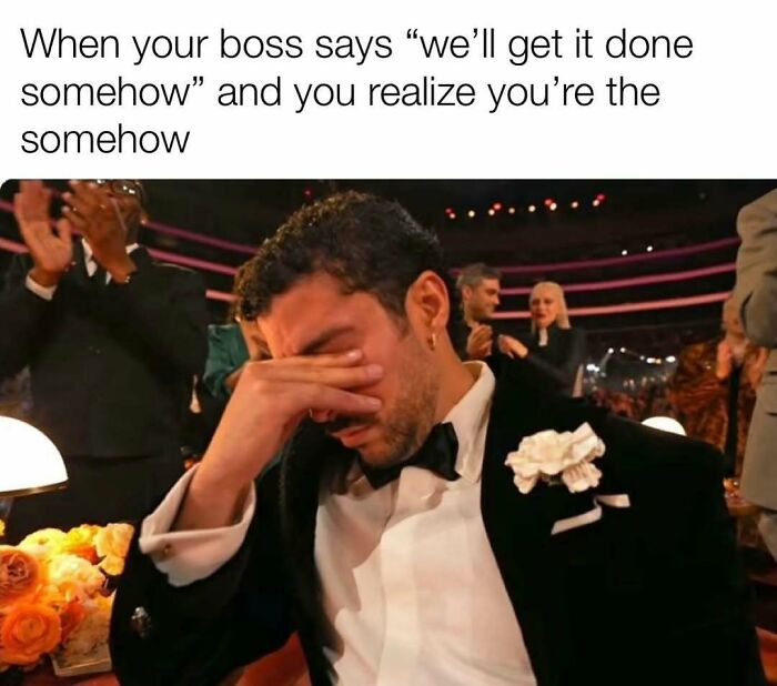 Man in a tuxedo covering his face at an event, expressing frustration in a relatable adulthood meme about work stress.