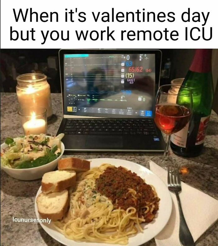 A nurse's Valentine's Day dinner with pasta, salad, wine, and a laptop displaying patient vitals for a remote ICU. Painfully relatable nurse memes.