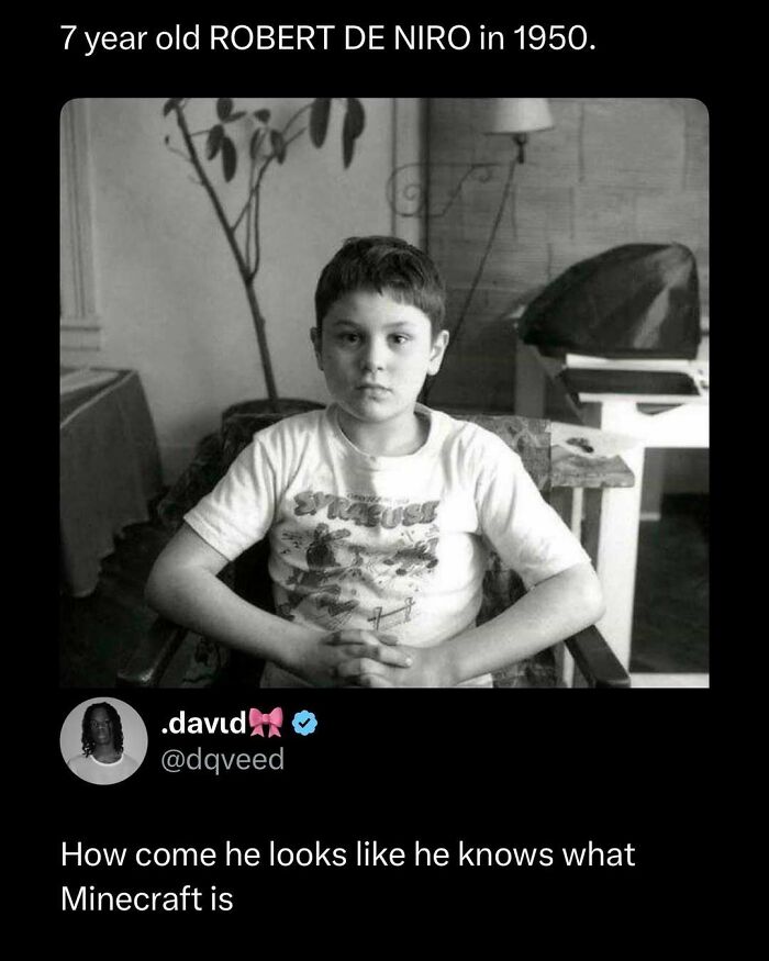 Black and white photo of a serious young boy sitting with hands clasped, featured in funny and interesting posts collection.