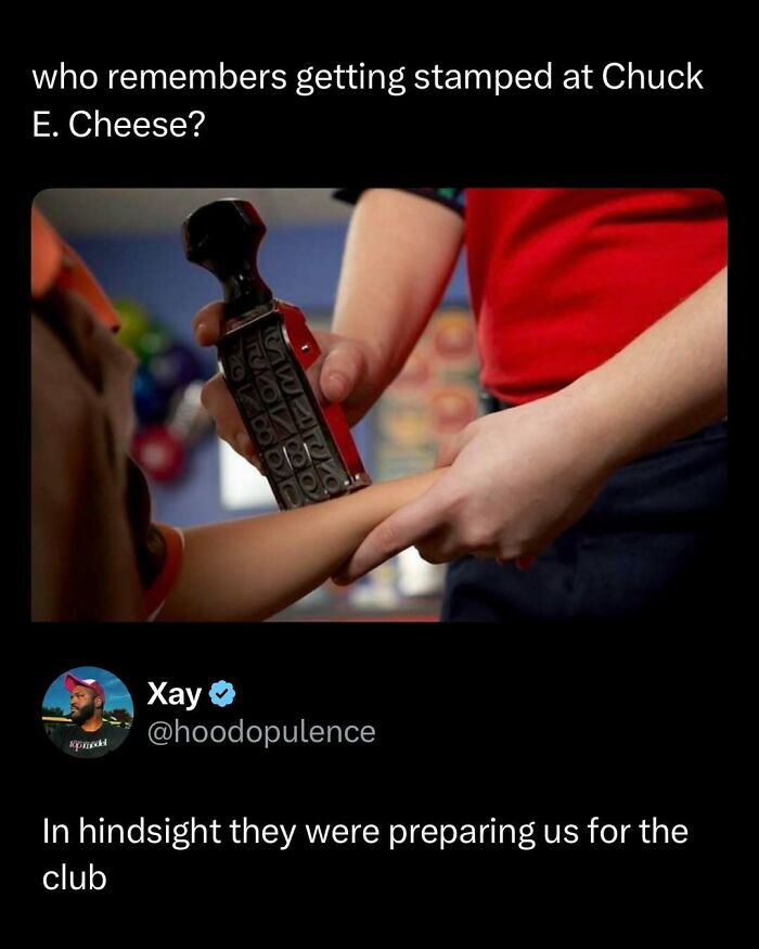 Child getting a hand stamped at Chuck E. Cheese with a funny post from Twitter for funny and interesting posts.