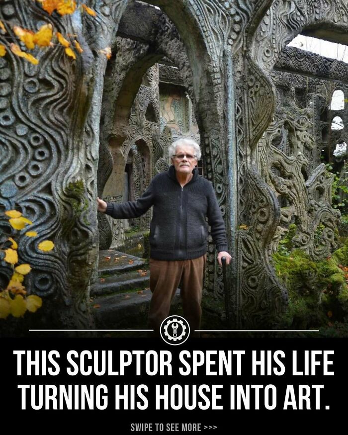 Elderly sculptor standing inside intricately carved stone arches, showcasing handmade artistic architectural work and creativity.