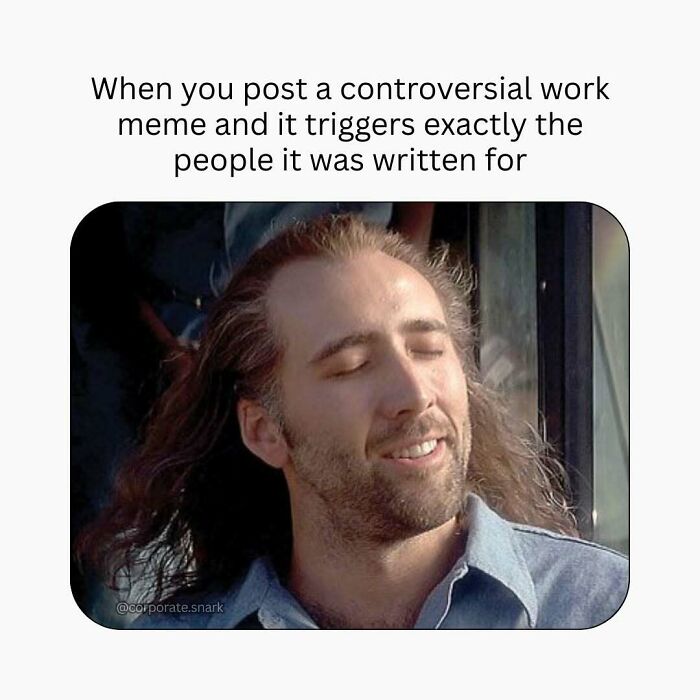 Man with long hair and closed eyes smiling, caption about posting a controversial work meme that triggers people.