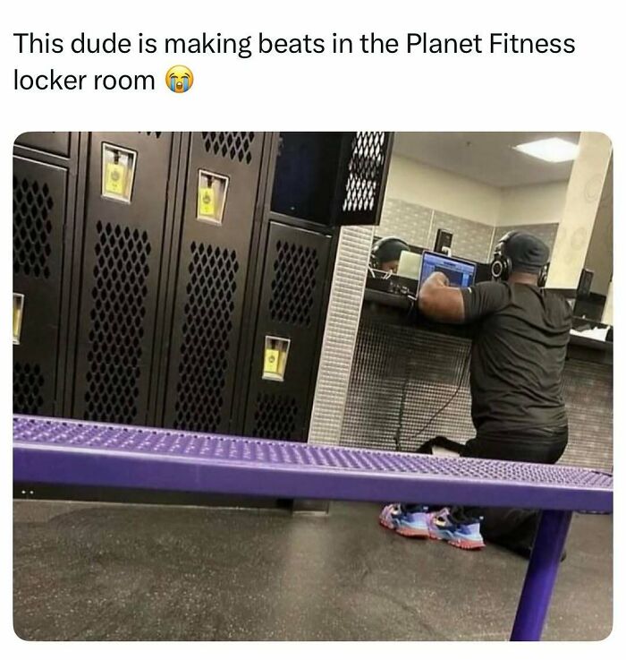 Man at gym locker room sitting on floor making music with headphones and laptop, a true Darwin Award contender moment