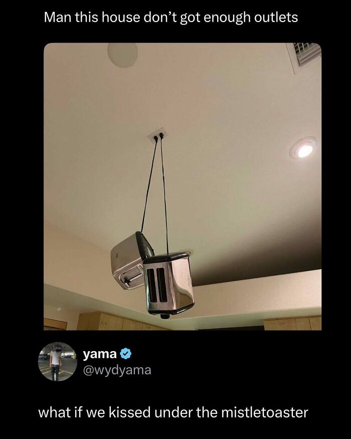 Two toasters plugged into a ceiling outlet, hanging upside down as a funny and interesting post about lack of outlets.