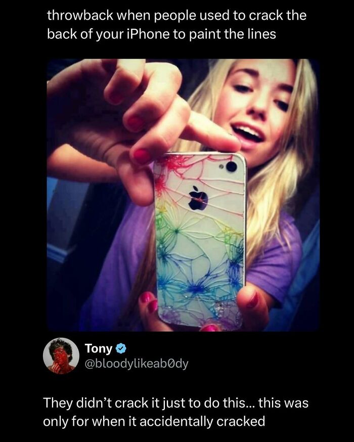 Young woman shows cracked iPhone back painted with colorful lines in a funny and interesting post to make your day better.
