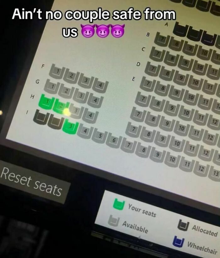 An unhinged pic of a cinema seating chart, showing three non-adjacent green selected seats, disrupting couples. Hilarious.