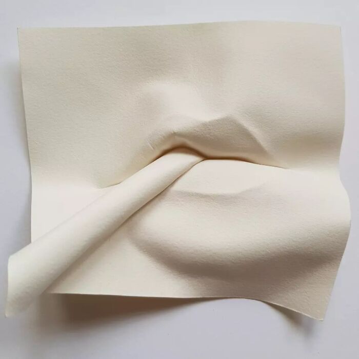 Face Emerging From The Paper