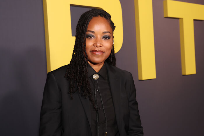 Woman with braided hair in a black suit at an event for The Pitt amid major cast shake up before season 2 finale