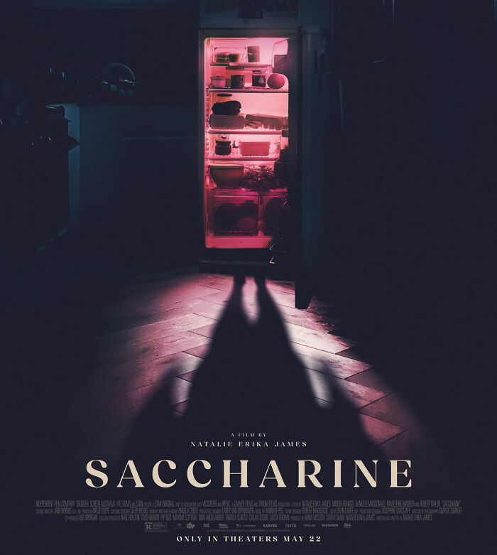 Saccharine horror movie poster with a fridge glowing pink, casting a long, terrifying shadow. Focus on being thinner than ever.
