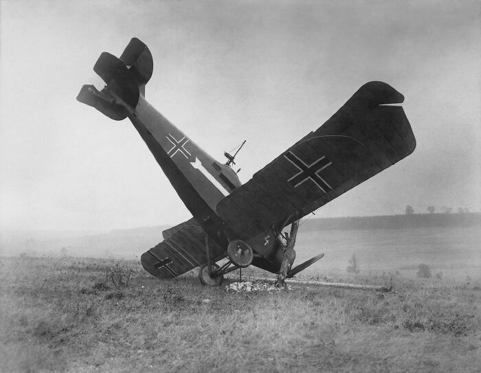 Rare and interesting photo of a vintage German warplane crash landing in a field from a time we will never experience.