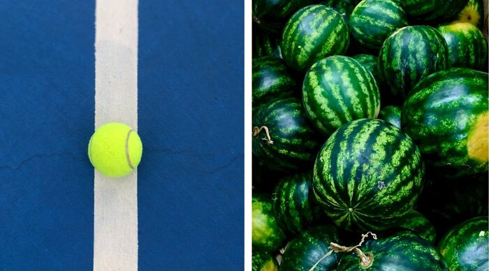 A tennis ball balanced on a court line next to a pile of green watermelons.
