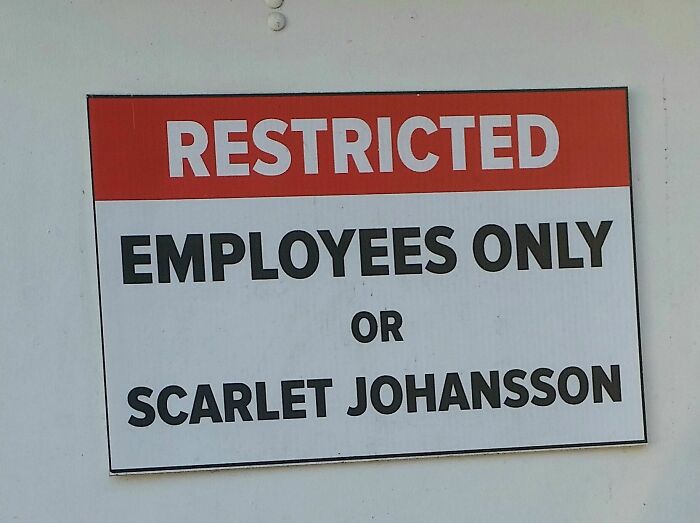 A humorous sign on a white wall reads RESTRICTED EMPLOYEES ONLY OR SCARLET JOHANSSON. Oddly specific rules, just like underwear.