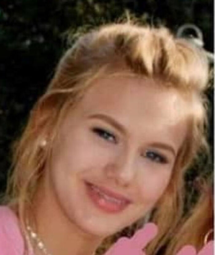 Young woman with blonde hair smiling softly, representing creepy and mysterious things people lose sleep over.