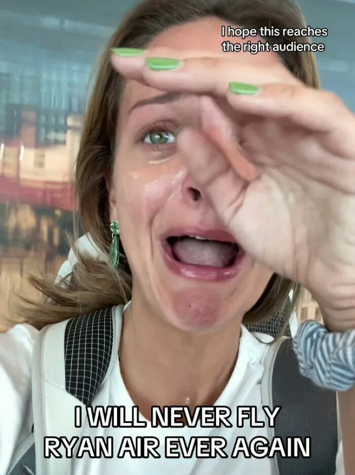 Woman with green nail polish crying and upset, reacting to a brutal wake-up call after trying to blast airline.