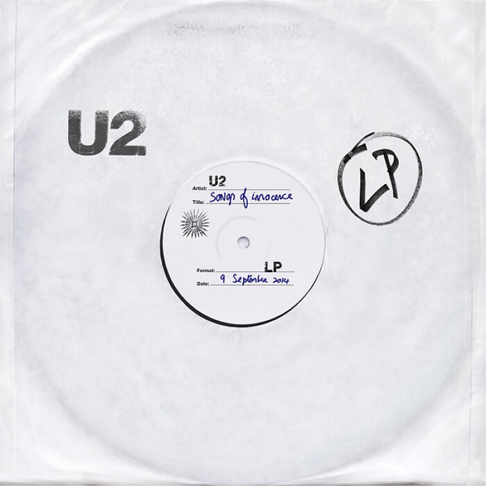 Vinyl record sleeve with U2 album song of innocence stamped on it, illustrating PR mistakes concept.
