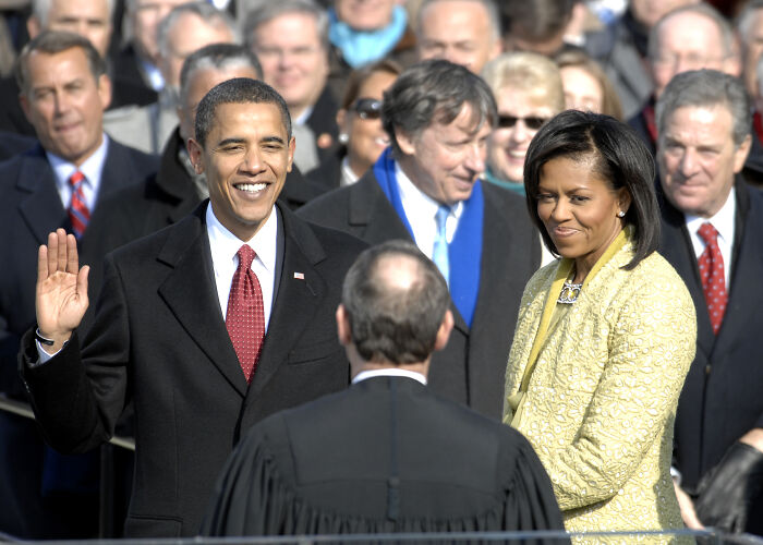 Barack Obama taking oath of office in a historic moment captured for a timeline of events from 1960 to 2010.