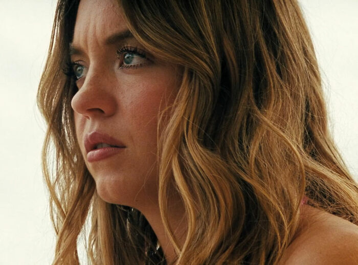 Sydney Sweeney in a close-up profile with intense expression, highlighting Euphoria backlash and character degradation in season 3.