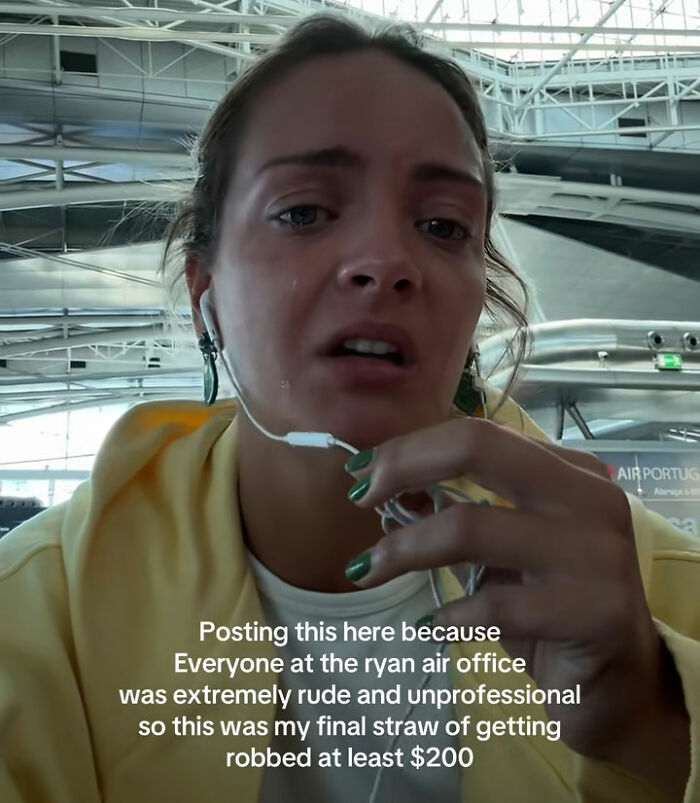 Young woman in airport sharing a frustrated health and wellness girly experience after harsh airline treatment.