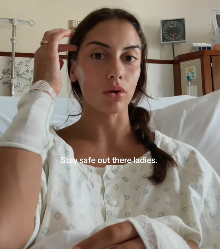 Young woman in hospital warning about risks of going to nail salons after emergency treatment for injuries.