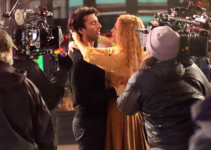 Actors embrace on set during filming, surrounded by crew and cameras capturing intense dramatic scene for She Lost Her Dragon.