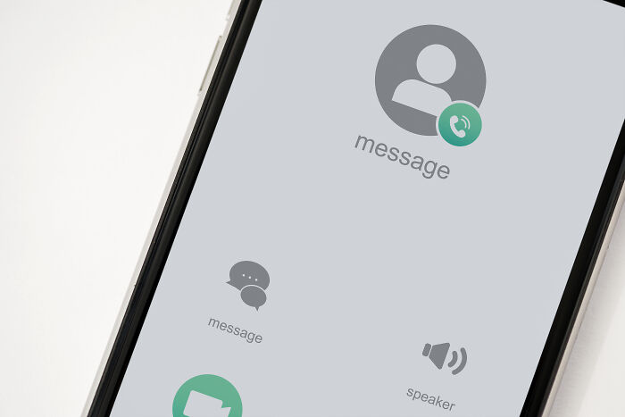 A smartphone screen displaying a profile icon with an incoming call notification and message icon, showing someone being cheated on.