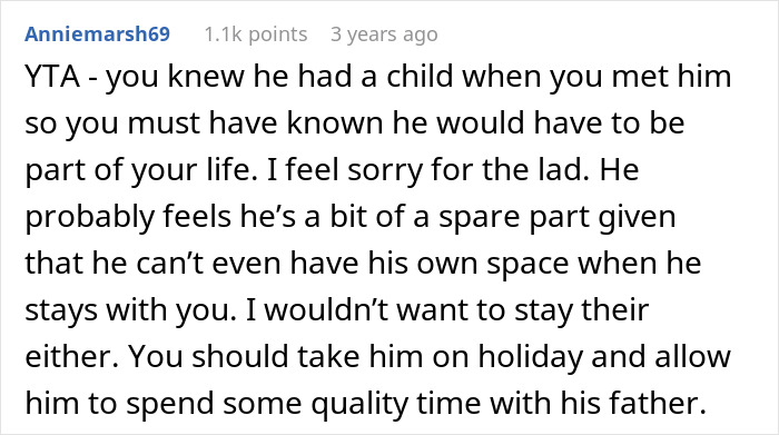 Screenshot of a Reddit comment discussing a woman paying for a family vacation but excluding her stepson.