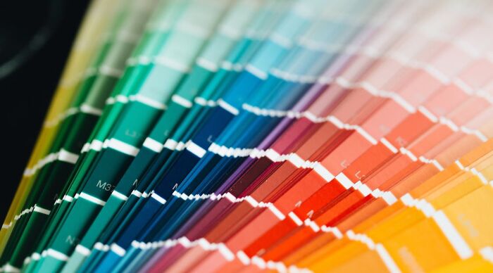 A fanned-out color blindness test with a rainbow of hues. Do you have eyes of an eagle?