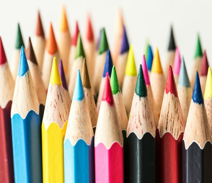 Close-up of colorful pencil tips in a row, illustrating creativity related to gynecologists questioning their career path.