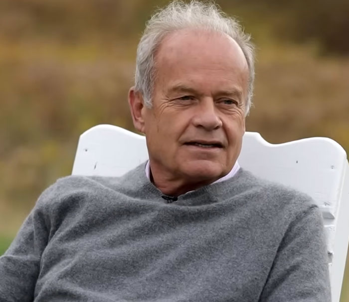 Older man sitting outdoors in a gray sweater, representing disturbing celebrity facts in a natural setting.