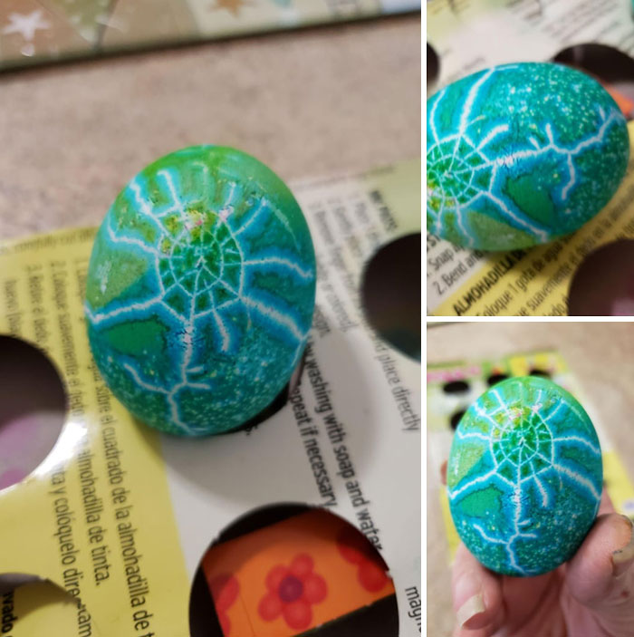 Blue and green DIY Easter egg showing creative crackle design with natural botanical dye effects on an egg carton background