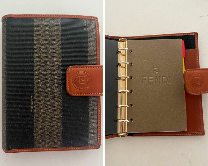 A Fendi planner found in Goodwill Bins, showcasing a brown and black striped exterior and interior Fendi logo.