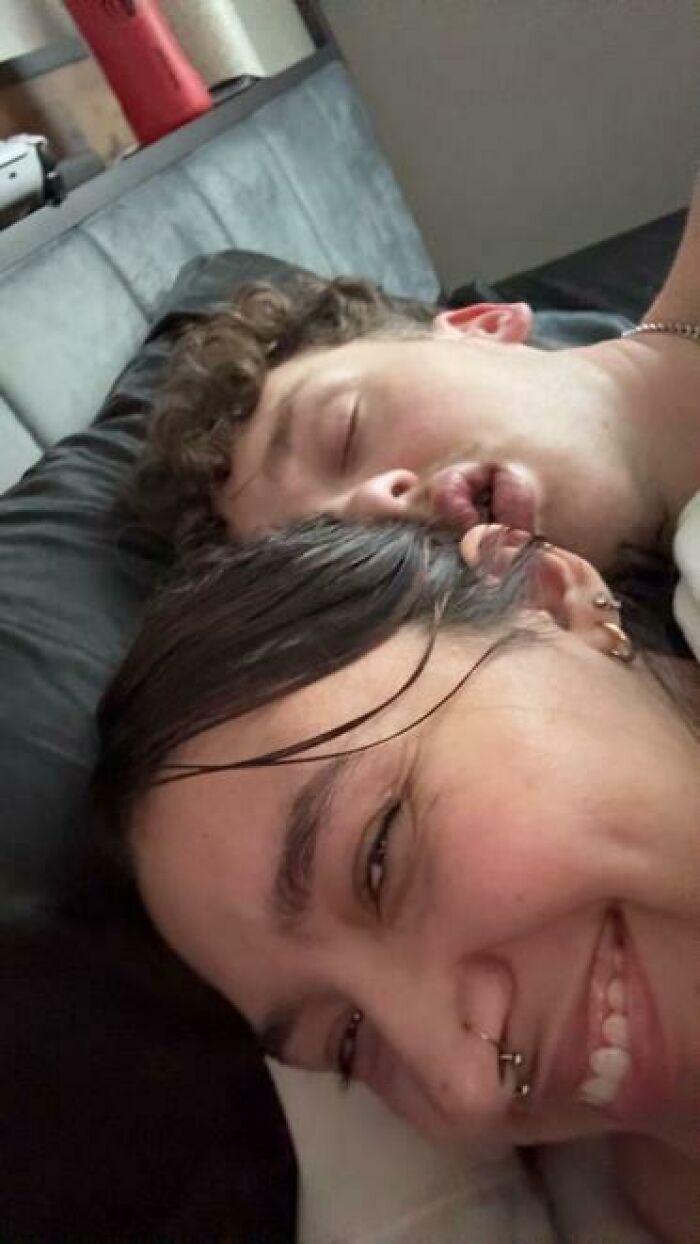 Two people caught sleeping in hilarious and unhinged ways, one smiling with piercings and the other with lips puckered.