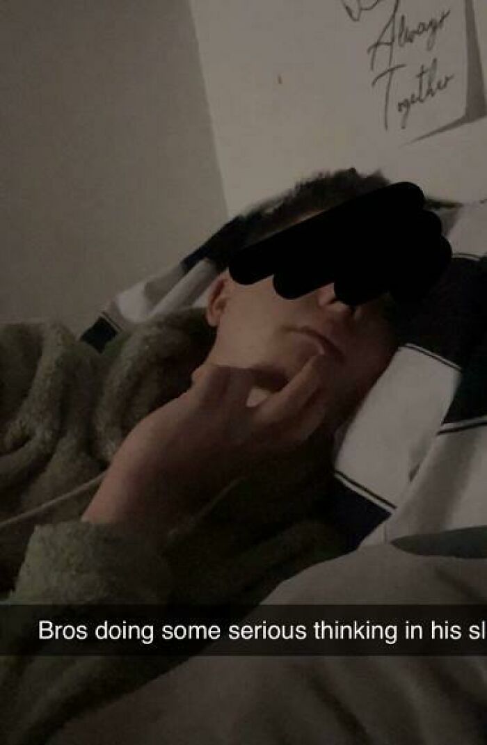 Person sleeping with hand on chin in a humorous pose, one of the 79 people caught sleeping in hilarious ways