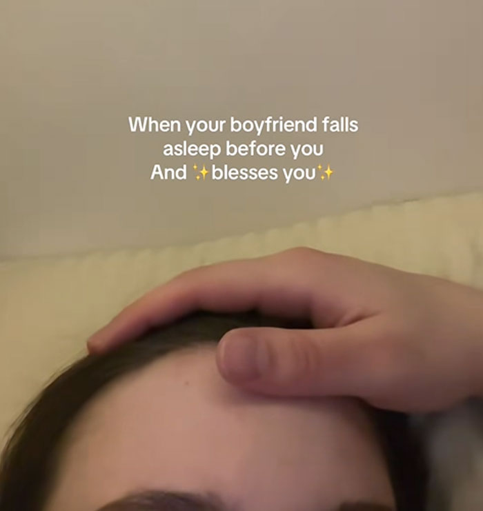 Person caught sleeping with a hand gently resting on their forehead in a sweet and funny sleeping moment.