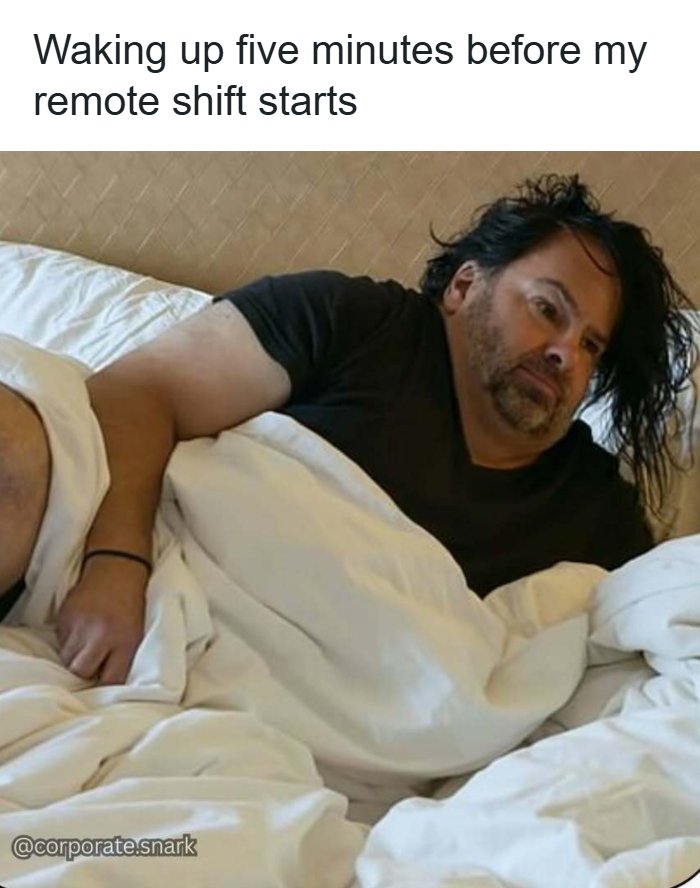 Tired man waking up in bed five minutes before remote work shift starts, illustrating work memes about meeting frustrations.