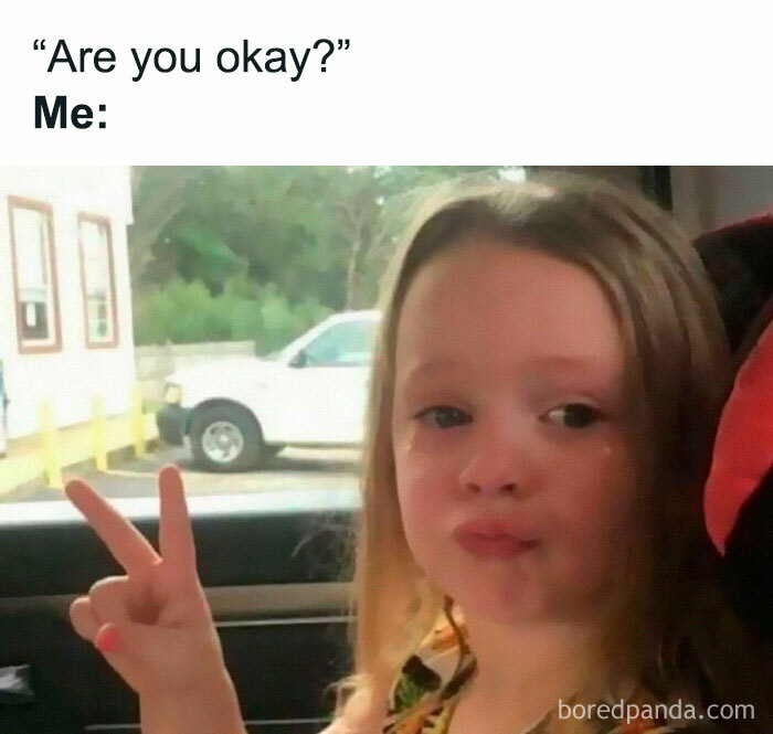 Young girl with a sad face making a peace sign in a car, meme scrolling humor for daily chuckle and mood boost.