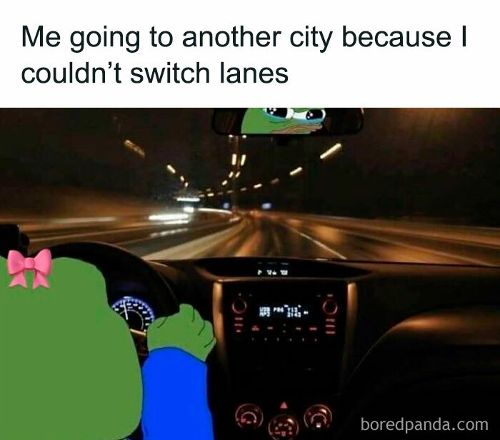Meme of a cartoon frog driving at night with caption about going to another city for meme scrolling humor.