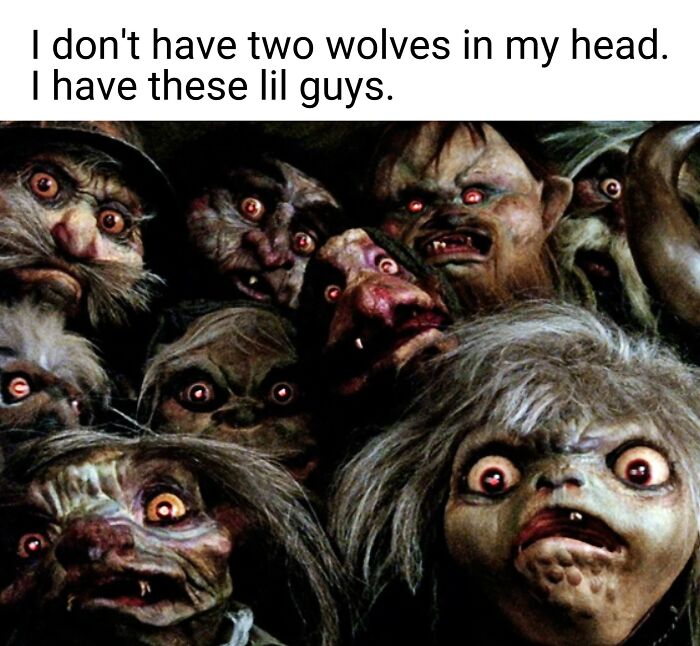 Group of creepy troll-like creatures with big eyes under text about having multiple little wolves in the head, humor meme.