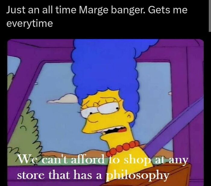 Marge Simpson in a car with a skeptical expression, featuring a relatable meme about humor and giving up on life.