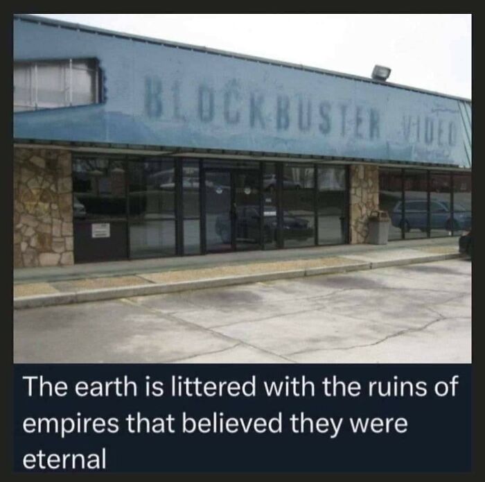 Abandoned Blockbuster video store with meme about the earth littered with ruins, highlighting relatable humor and life struggles.