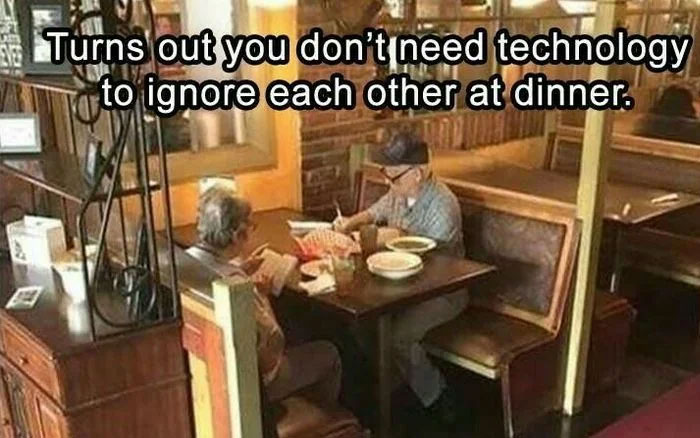 Two older people sitting and ignoring each other at a restaurant table, a funny safe-for-work meme about ignoring.