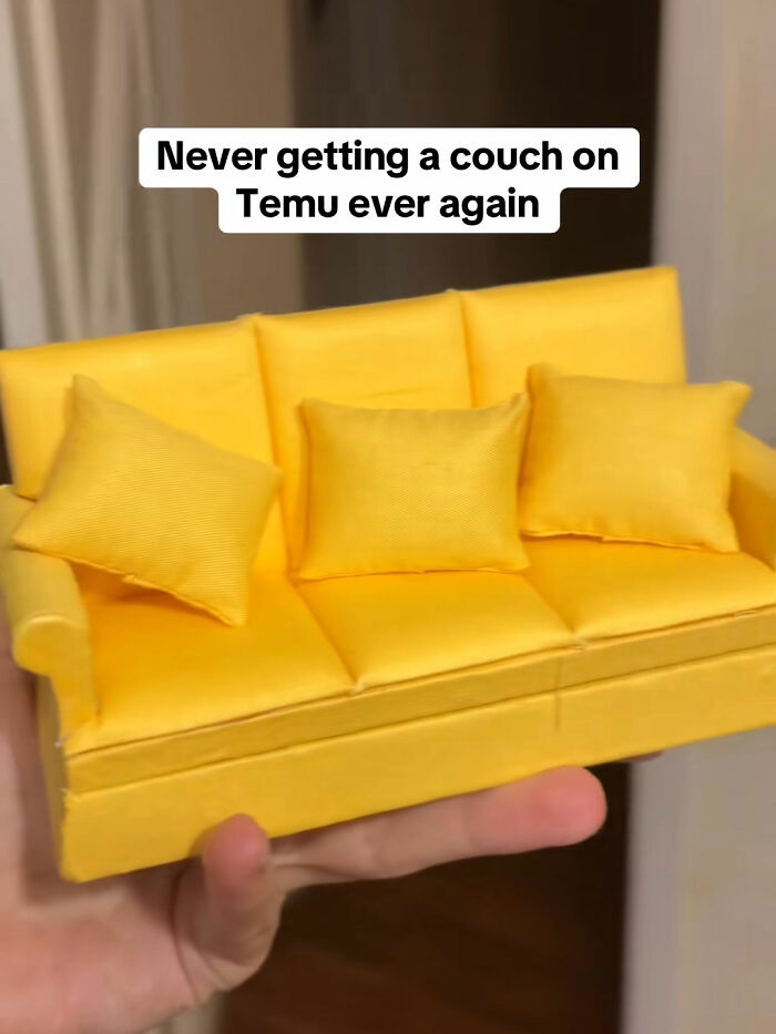 Miniature yellow couch held in a hand, illustrating a funny lesson from ordering something from Temu online.