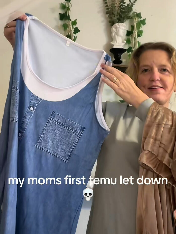 Woman holding up a sleeveless dress with denim print, sharing a funny Temu order experience with a disappointed expression.