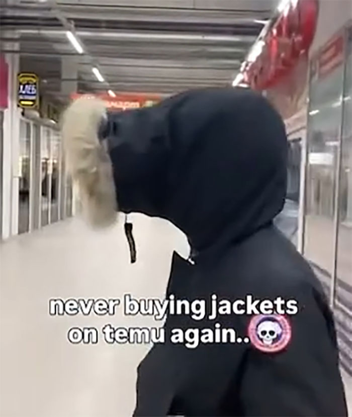 Person in a black jacket with fur hood at a store, highlighting a hilarious lesson about ordering from Temu jackets.