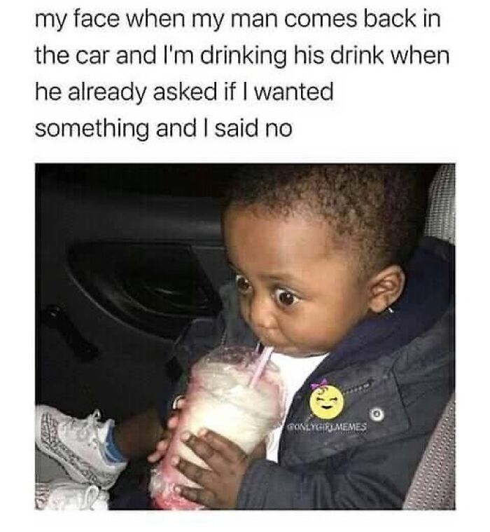 Toddler with wide eyes drinking from a cup in a car, capturing a hilarious moment about romantic relationships.