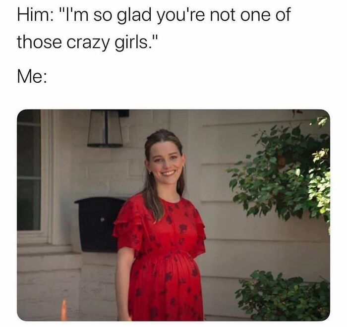 Smiling woman in a red dress standing outside a house, illustrating a funny moment in romantic relationships memes.