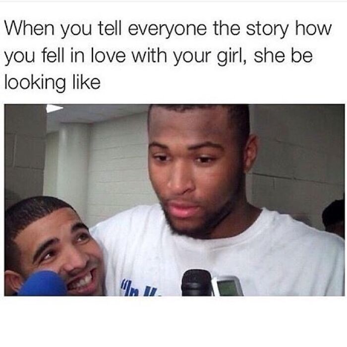 Two men during an interview, one smiling and looking up, illustrating hilarious memes about romantic relationships.