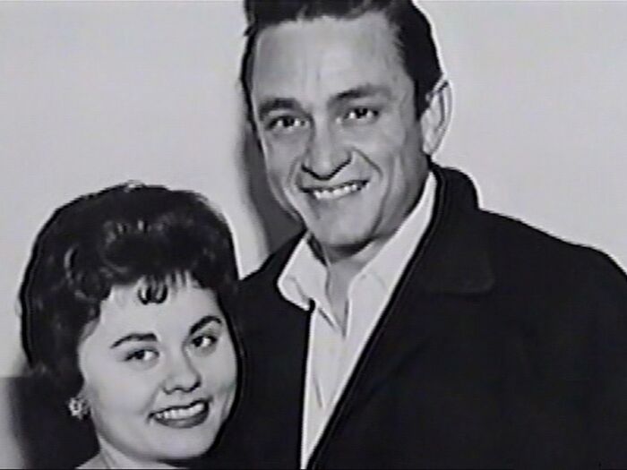 Black and white photo of a smiling couple, evoking creepy and mysterious feelings that people lose sleep over.